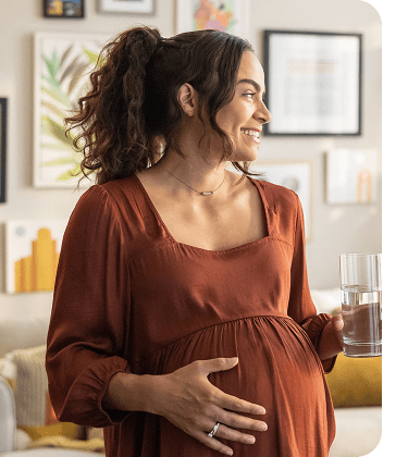 Actor portrayal of a pregnant woman smiling
